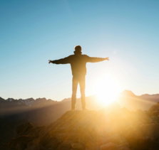 person standing on hill
